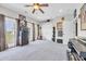 Spacious loft with French doors, a ceiling fan, musical instruments, and a view of the lush, green lawn at 338 St. Julian Ln., Myrtle Beach, SC 29579