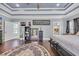 Spacious bedroom with hardwood floors, stylish decor, and an ensuite bathroom at 338 St. Julian Ln., Myrtle Beach, SC 29579