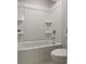 Bathroom with a shower and tub combination and a toilet at 3391 Moss Bridge Ln., Myrtle Beach, SC 29579