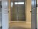 Luxurious shower with frameless glass door, tiled walls and overhead lighting at 3391 Moss Bridge Ln., Myrtle Beach, SC 29579