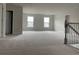 Upstairs bonus room with wall-to-wall carpet and two windows at 3391 Moss Bridge Ln., Myrtle Beach, SC 29579