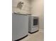 Convenient laundry room with modern washer, dryer, and wire shelving at 3391 Moss Bridge Ln., Myrtle Beach, SC 29579