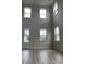 The expansive living area has high ceilings, large windows and plenty of natural light throughout at 3391 Moss Bridge Ln., Myrtle Beach, SC 29579