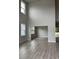 Bright living room features soaring ceilings, large windows and wood-look floors for a spacious and modern feel at 3391 Moss Bridge Ln., Myrtle Beach, SC 29579