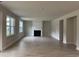 Open-concept living area includes an elegant fireplace and wood-look floors for a cozy yet modern design at 3391 Moss Bridge Ln., Myrtle Beach, SC 29579