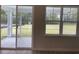 Relaxing screened porch offers views of the lush backyard, perfect for enjoying the outdoors at 3391 Moss Bridge Ln., Myrtle Beach, SC 29579