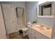 Well-maintained bathroom featuring a shower with curtain, white vanity, and ample storage at 3401 Dunes St. # A3, North Myrtle Beach, SC 29582