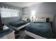 Comfortable bedroom featuring two beds with plush bedding and soft natural light at 3401 Dunes St. # A3, North Myrtle Beach, SC 29582