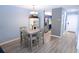 Bright dining area featuring a stylish table with four chairs and modern decor at 3401 Dunes St. # A3, North Myrtle Beach, SC 29582