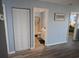 Hallway featuring a bathroom and bedroom access, enhancing the functional layout of the home at 3401 Dunes St. # A3, North Myrtle Beach, SC 29582