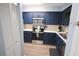 Kitchen with stainless steel appliances, blue cabinets, and light countertops at 3401 Dunes St. # A3, North Myrtle Beach, SC 29582