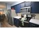 Kitchen showcasing stainless steel appliances and dark blue cabinets at 3401 Dunes St. # A3, North Myrtle Beach, SC 29582