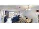 Open-concept living and dining area with sliding glass doors to a patio at 3401 Dunes St. # A3, North Myrtle Beach, SC 29582