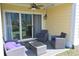 Inviting outdoor patio includes comfortable lounge furniture, a ceiling fan, and scenic views at 3401 Dunes St. # A3, North Myrtle Beach, SC 29582