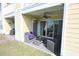 Cozy covered patio featuring comfortable seating, ceiling fan, and sliding glass doors at 3401 Dunes St. # A3, North Myrtle Beach, SC 29582