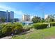 Scenic view of neighboring buildings, lush greenery, and a clear blue sky in the distance at 3401 Dunes St. # A3, North Myrtle Beach, SC 29582