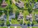 Aerial view showcasing the property's spacious backyard and proximity to neighboring homes and green spaces at 3910 Stillwood Dr., Myrtle Beach, SC 29588