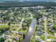 Beautiful aerial view of a residential neighborhood featuring a tranquil waterway and mature trees at 3910 Stillwood Dr., Myrtle Beach, SC 29588