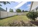 Spacious backyard with a well-maintained lawn, privacy fence, and a mature tree for shade at 3910 Stillwood Dr., Myrtle Beach, SC 29588