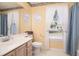 Bright bathroom featuring a single sink vanity, a large mirror, and natural light from the window at 3910 Stillwood Dr., Myrtle Beach, SC 29588