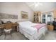 Bedroom with vaulted ceiling, desk, built in shelves, and window with natural light at 3910 Stillwood Dr., Myrtle Beach, SC 29588