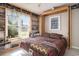Charming bedroom featuring a Murphy bed, custom built-ins, and a window with sun-filled outdoor views at 3910 Stillwood Dr., Myrtle Beach, SC 29588