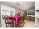 Cozy dining area featuring stylish chairs, chandelier, and an open floor plan at 3910 Stillwood Dr., Myrtle Beach, SC 29588