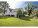 Well-manicured lawn surrounds the charming home, complemented by tidy landscaping at 3910 Stillwood Dr., Myrtle Beach, SC 29588