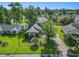 Charming single-story home with a well-manicured lawn, mature trees, and an inviting driveway at 3910 Stillwood Dr., Myrtle Beach, SC 29588