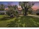 Charming home with lush front yard, mature trees, well-maintained lawn, and inviting landscaping at 3910 Stillwood Dr., Myrtle Beach, SC 29588