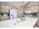 Spacious kitchen features ample counter space and cabinetry, with modern appliances and views to other areas at 3910 Stillwood Dr., Myrtle Beach, SC 29588