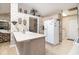An open kitchen showcases a breakfast bar with seating, a refrigerator, and views to another room at 3910 Stillwood Dr., Myrtle Beach, SC 29588