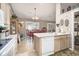 Open kitchen showcases appliances, a breakfast bar, and a dining area with sliding glass doors to the exterior at 3910 Stillwood Dr., Myrtle Beach, SC 29588