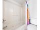 Bright bathroom featuring a tub-shower combo with a multi-colored shower curtain and a white toilet at 4000 North Ocean Blvd. # 1002, North Myrtle Beach, SC 29582
