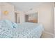 A well-lit bedroom with seamless access to a dressing area, complemented by a calming color scheme at 4000 North Ocean Blvd. # 1002, North Myrtle Beach, SC 29582