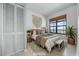 Cozy staged bedroom with neutral decor and view at 4000 North Ocean Blvd. # 1002, North Myrtle Beach, SC 29582