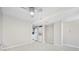 A spacious living room with neutral tones and tile flooring, next to the kitchen at 4000 North Ocean Blvd. # 1002, North Myrtle Beach, SC 29582