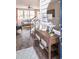 Welcoming foyer showcases a wooden console table with decor, a staircase, and a glimpse into the comfortable living room at 421 Falling Leaf Loop, Myrtle Beach, SC 29588