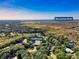 Panoramic aerial view showcasing community clubhouse, pool, golf course and the Waccamaw River in the distance at 423 Chapman Loop, Pawleys Island, SC 29585