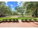 A view of the well-manicured backyard, green grass, and mature trees at 423 Chapman Loop, Pawleys Island, SC 29585