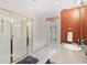 A bright bathroom with separate tub and shower with detailed cherry cabinets and granite countertop at 423 Chapman Loop, Pawleys Island, SC 29585