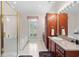 Bright bathroom with a glass shower, soaking tub, and granite countertops at 423 Chapman Loop, Pawleys Island, SC 29585