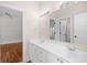 Bright bathroom with double vanity and neutral tiling at 423 Chapman Loop, Pawleys Island, SC 29585