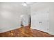 An empty bedroom with hardwood floors, view of an ensuite bathroom and closet at 423 Chapman Loop, Pawleys Island, SC 29585