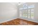 An empty bedroom with hardwood floors and large bright window at 423 Chapman Loop, Pawleys Island, SC 29585