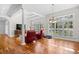 Bright sunroom featuring white columns, many windows and hardwood flooring at 423 Chapman Loop, Pawleys Island, SC 29585
