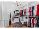 Spacious walk-in closet with custom shelving and a chandelier at 423 Chapman Loop, Pawleys Island, SC 29585