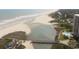 Aerial view showcasing the beach, river, and lush landscape at 430 Ocean Creek Dr. # 2534, Myrtle Beach, SC 29572