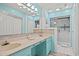 Bathroom featuring a double sink vanity and glass-enclosed shower at 430 Ocean Creek Dr. # 2534, Myrtle Beach, SC 29572