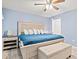 Bedroom with a king bed, an upholstered bench and stylish bedside tables at 430 Ocean Creek Dr. # 2534, Myrtle Beach, SC 29572